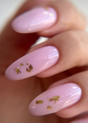 IN.HYPE finished baby pink nails in lifestyle shot showing natural-strength, low-bulk result