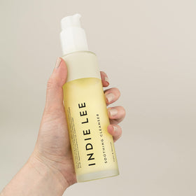 Indie Lee cleanser in hand demonstrating gentle application