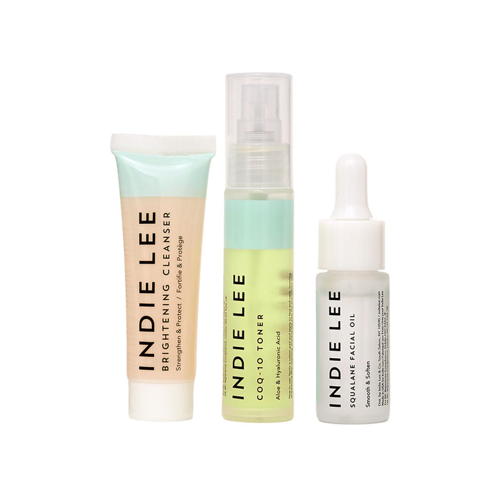 Indie Lee front packaging of the three-piece discovery kit showing travel bottles for easy routine