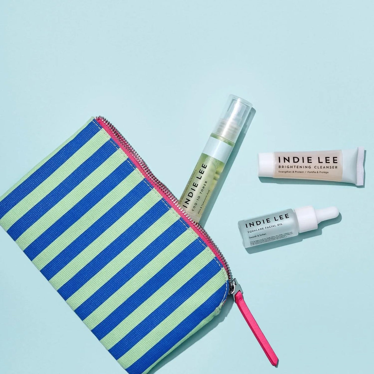 Indie Lee squalane facial oil dropper dispensing oil to lock in moisture without greasiness