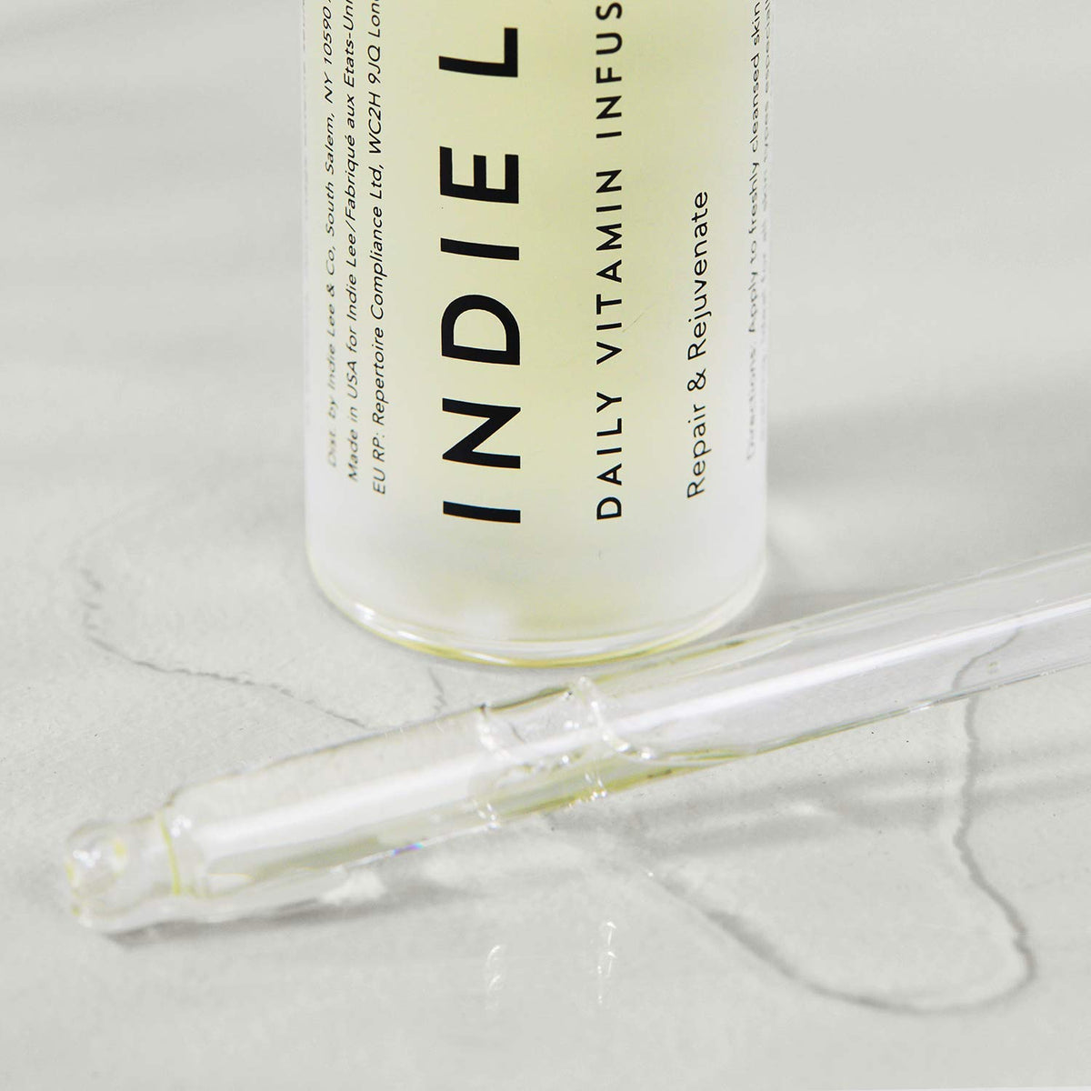 Indie Lee oil texture close-up revealing lightweight absorption and sheen