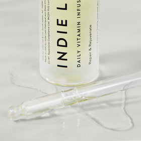 Indie Lee oil texture close-up revealing lightweight absorption and sheen