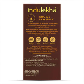INDULEKHA oil drop texture on skin showing lightweight absorption