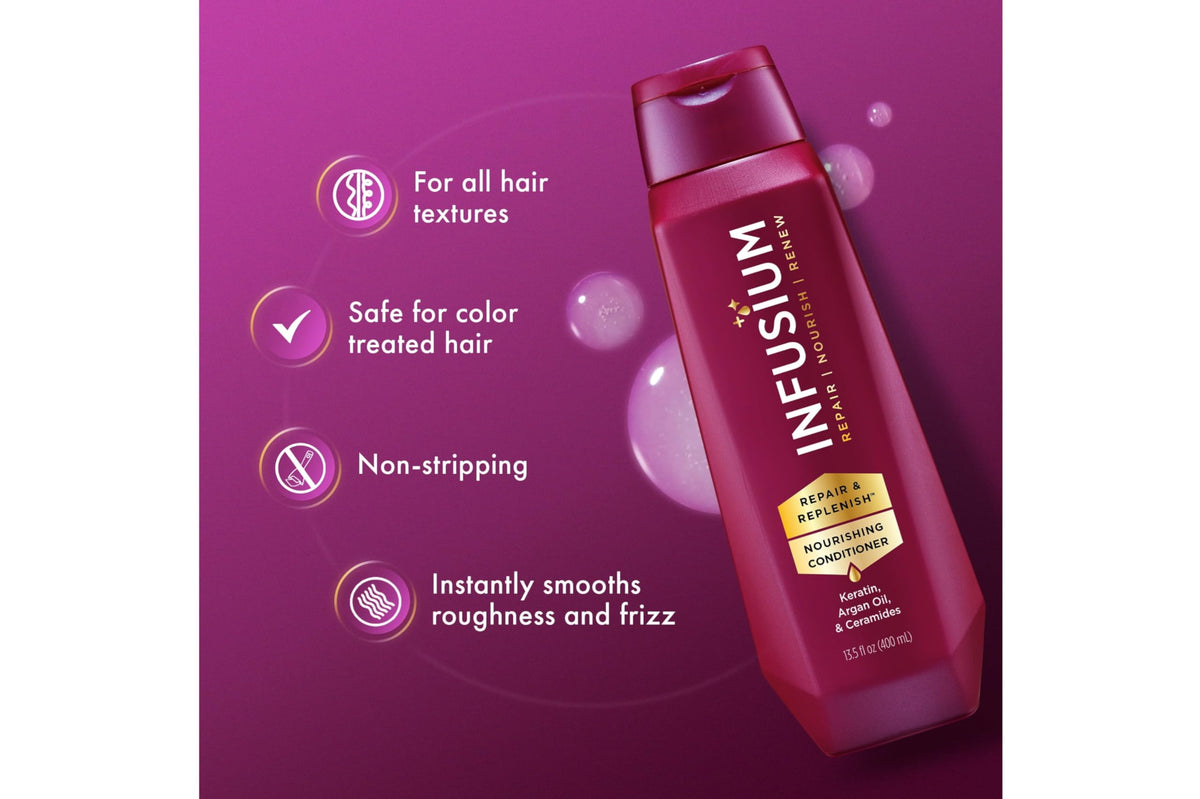 Infusium conditioner creamy texture on fingers to show smoothing benefit