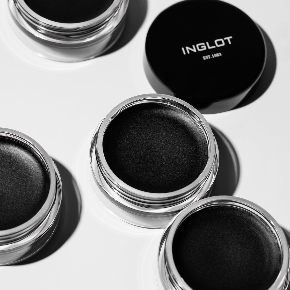 Inglot AMC gel eyeliner 77 on a vanity table in a lifestyle setting for daily use