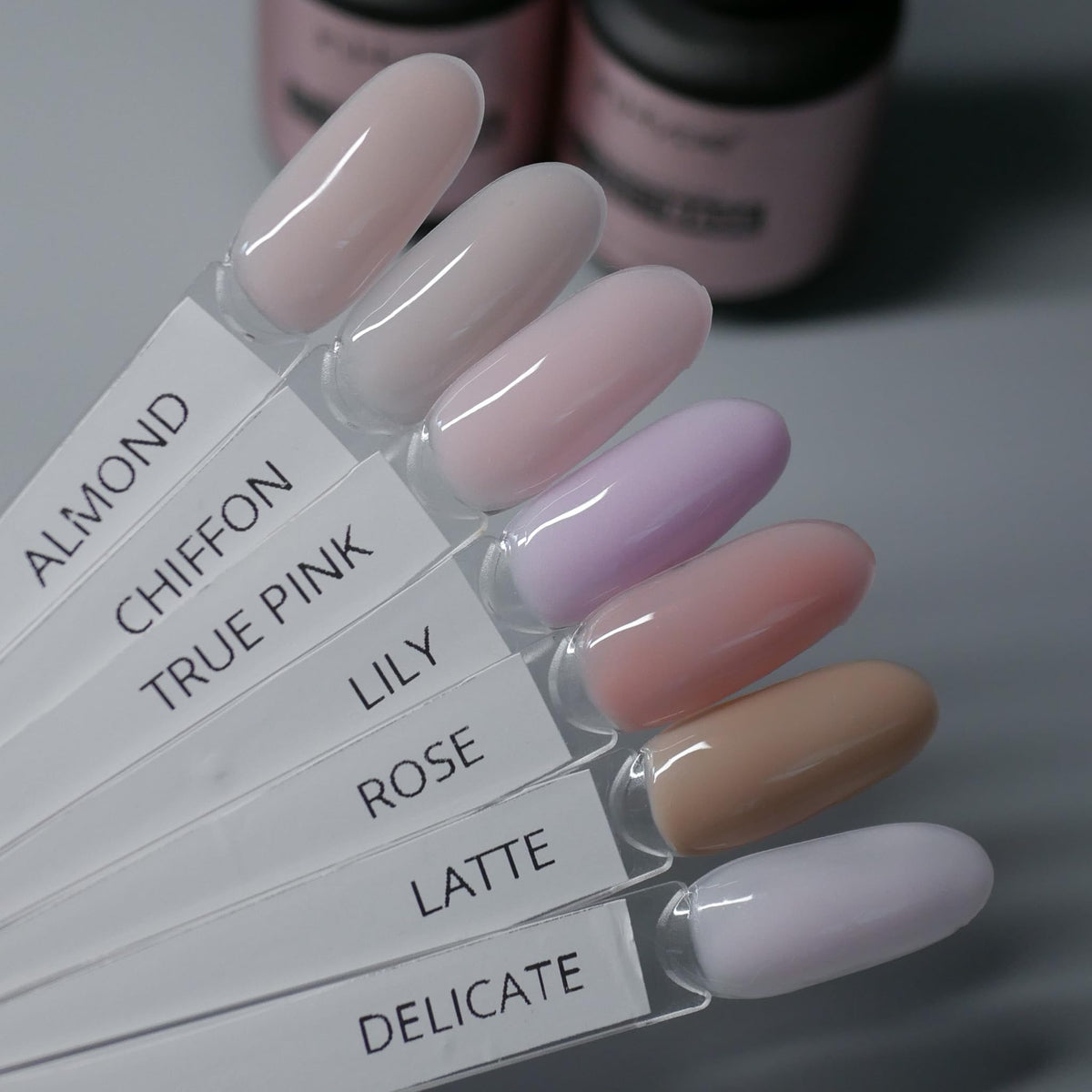 IN.HYPE bottle next to a ruler showing compact salon-friendly size