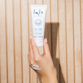 Inis being applied to hands demonstrating fast hydration benefit