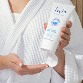 Inis lotion on bathroom shelf staged to show daily routine and freshness