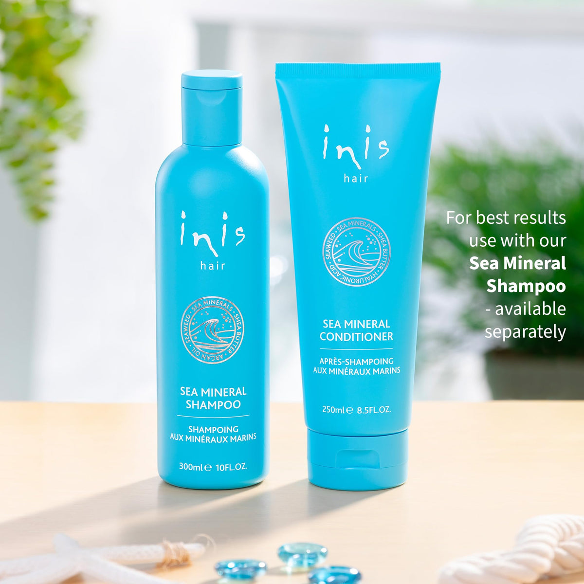 Inis conditioner on bathroom shelf with ocean view highlighting brand ethos