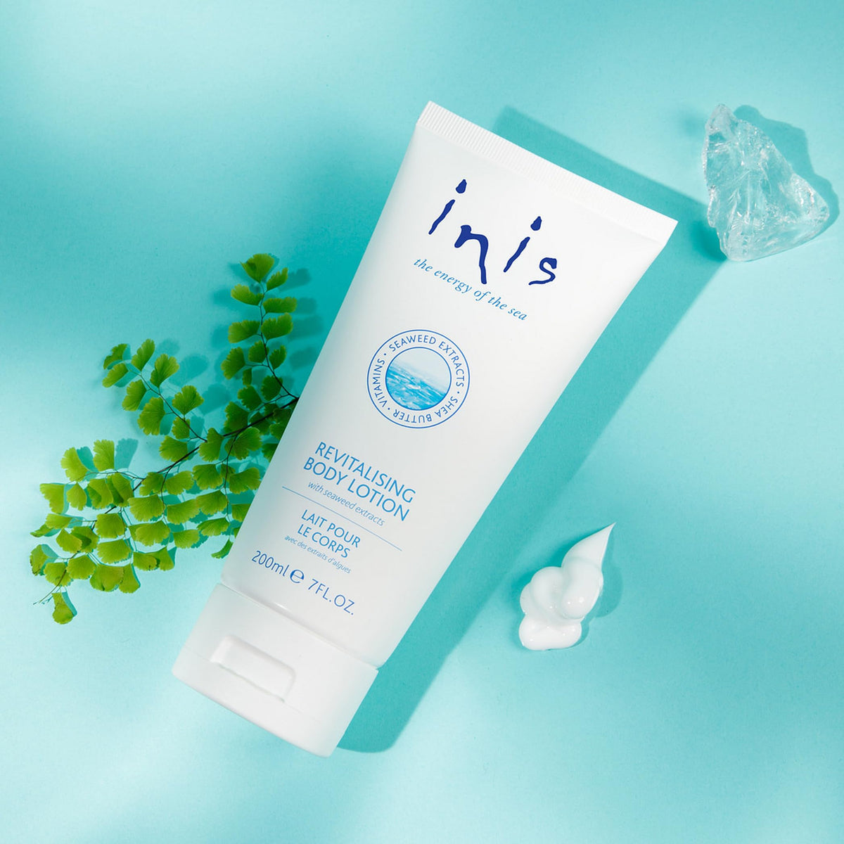Inis lotion texture close-up highlighting smooth shea butter hydration