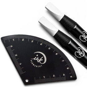 Ink Permanent front view of the black aluminum ruler and two white pencils showing professional kit benefit