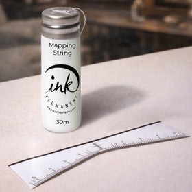 Ink Permanent close-up of pre-inked mapping string delivering crisp guide lines