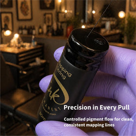 Ink Permanent roll beside a hand for scale showing large spool length benefit