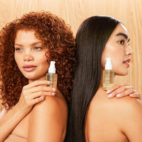 INNERSENSE applying oil to scalp for targeted nourishment