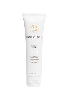 INNERSENSE applying Quiet Calm Curl Control cream to damp hair for frizz control