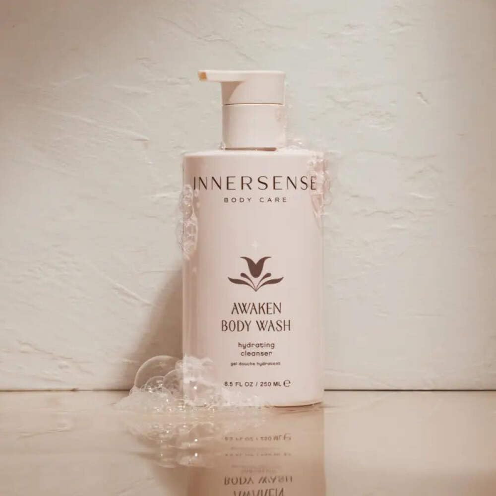 INNERSENSE body wash being applied in shower for fresh, hydrated skin