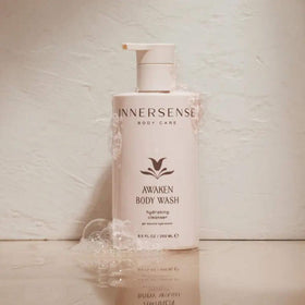 INNERSENSE body wash being applied in shower for fresh, hydrated skin