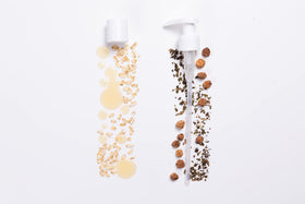 INNERSENSE duo bottles in hand scale comparison showing travel-friendly size benefit