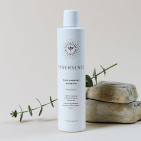 INNERSENSE shampoo on wet hair in shower illustrating lightweight volumizing benefit