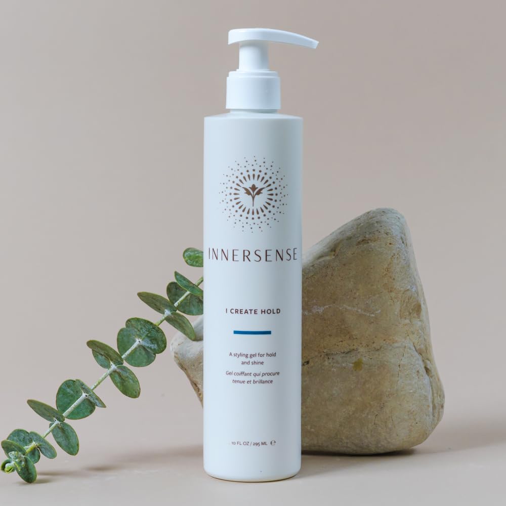 INNERSENSE bottle in hand comparing the 32 fl oz professional size