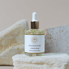 INNERSENSE bottle on a bathroom counter in a minimalist routine setting