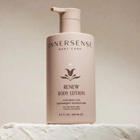 INNERSENSE applying Renew lotion to forearm demonstrating quick, non-greasy absorption