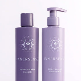 INNERSENSE shampoo being poured to show purple hue and gentle cleanse benefit