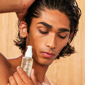 INNERSENSE 1 fl oz bottle next to common item for scale