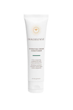 INNERSENSE travel trio beside a hand to show compact size benefit