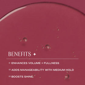 INNERSENSE product in hand while blow-drying hair to show lift and natural movement benefit