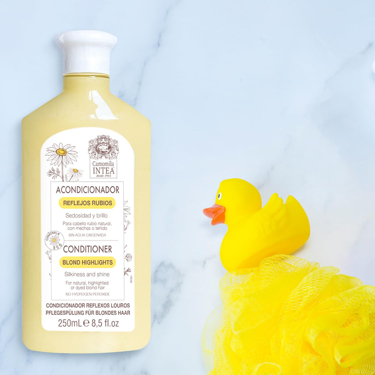 Intea lotion spray application on towel-dried hair for even lightening