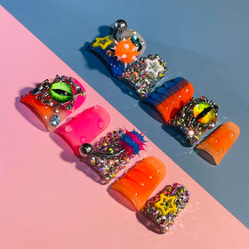 IntoVibes close-up of orange barbell charm highlighting 3D detail and eye-catching effect