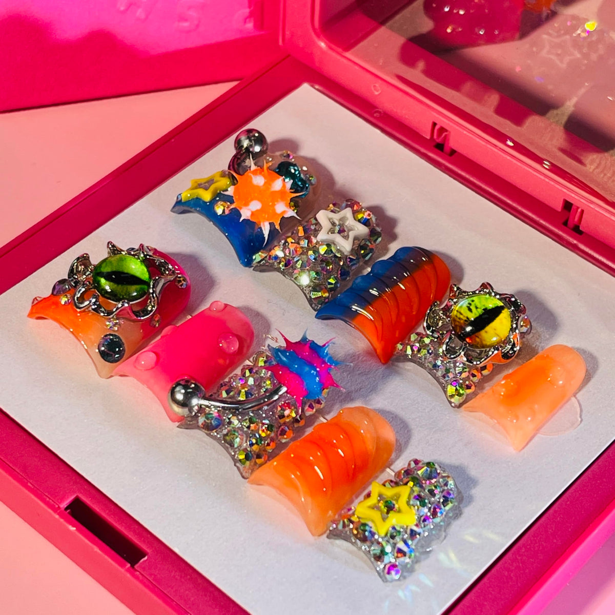 IntoVibes front packaging view showing glossy short duck nails and orange charm benefit styling