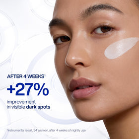 IOPE applying cream on hand demonstrating quick absorption and even application