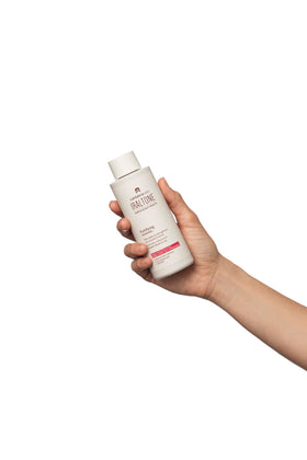 IRALTONE bottle in hand demonstrating easy dispensing and control