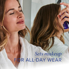 iS CLINICAL bottle in hand showing travel size convenience and on-the-go benefit