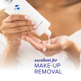 iS CLINICAL cream applied to hand showing gentle, moisturizing spreadability