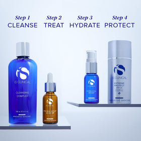 iS CLINICAL serum placed on vanity to suggest calming skincare routine