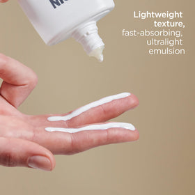 ISDIN application on hand demonstrating smooth spreadability and quick absorption