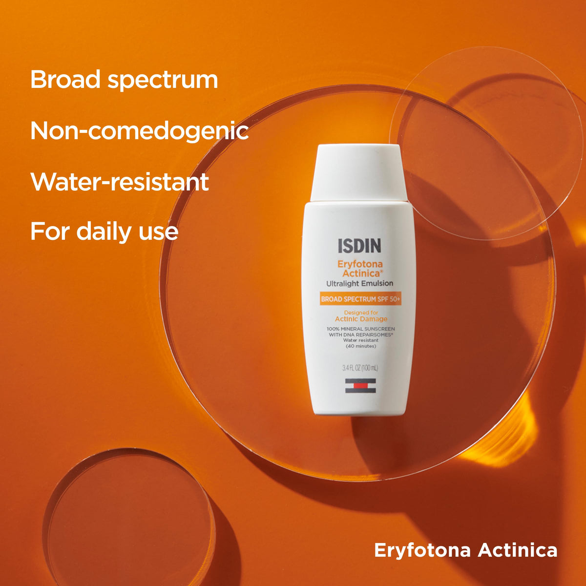 ISDIN Eryfotona beside a ruler for scale showing the 3.4 fl oz travel friendly size