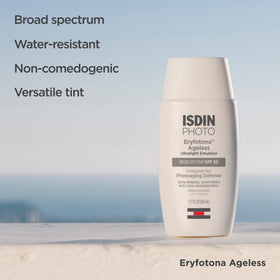 ISDIN tube in hand spreading tint showing natural finish and even tone benefit