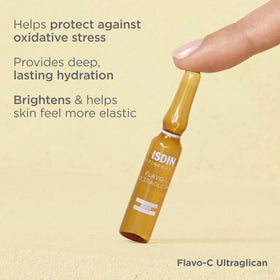 ISDIN Flavo-C ampoule open application on fingertips for precise morning use