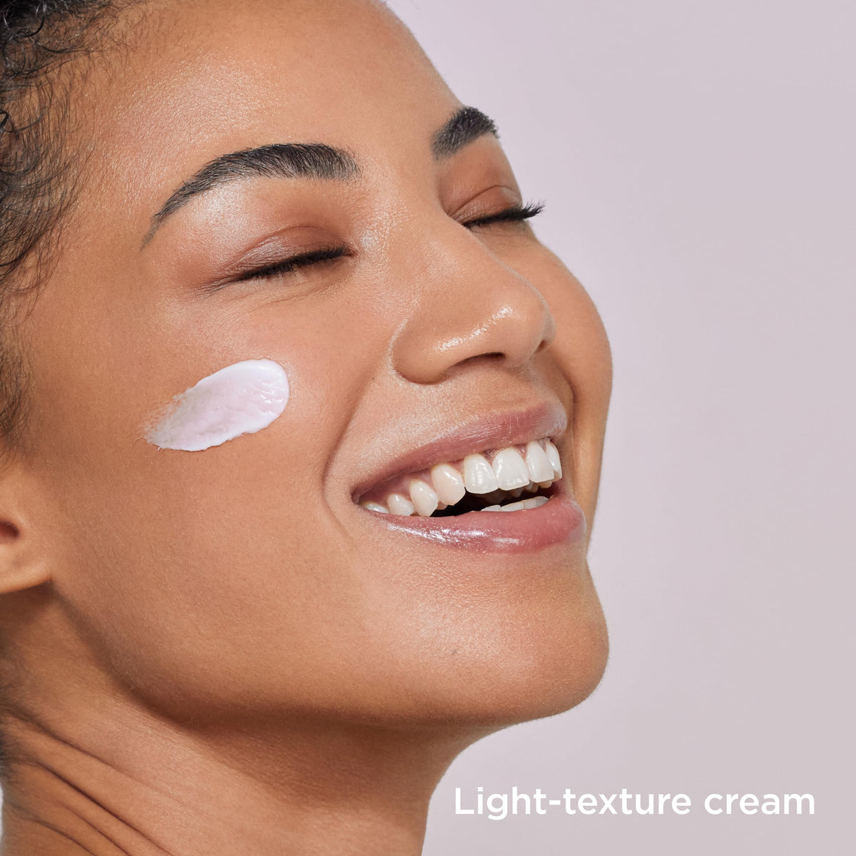 ISDIN tube open with cream being dispensed for easy application