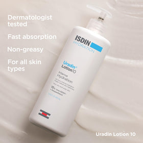 ISDIN Uradin 10 being applied to forearm, soothes and relieves dry skin