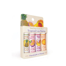 Island Soap & Candle Works lip balms on tropical backdrop suggesting Hawaiian handmade appeal