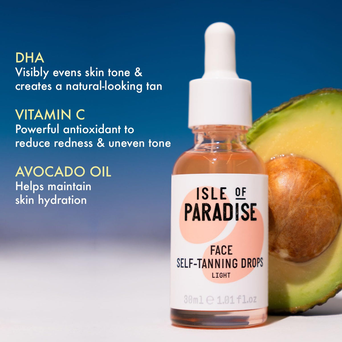 Isle of Paradise drops applied onto back of hand showing color build benefit: visible, natural bronze