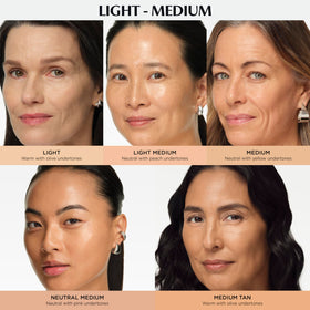 IT Cosmetics swatch on wrist illustrating Light Medium shade match and natural glow
