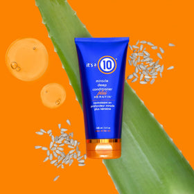 It's A 10 Miracle Deep Conditioner applying to hair mid-lengths for smoother manageability