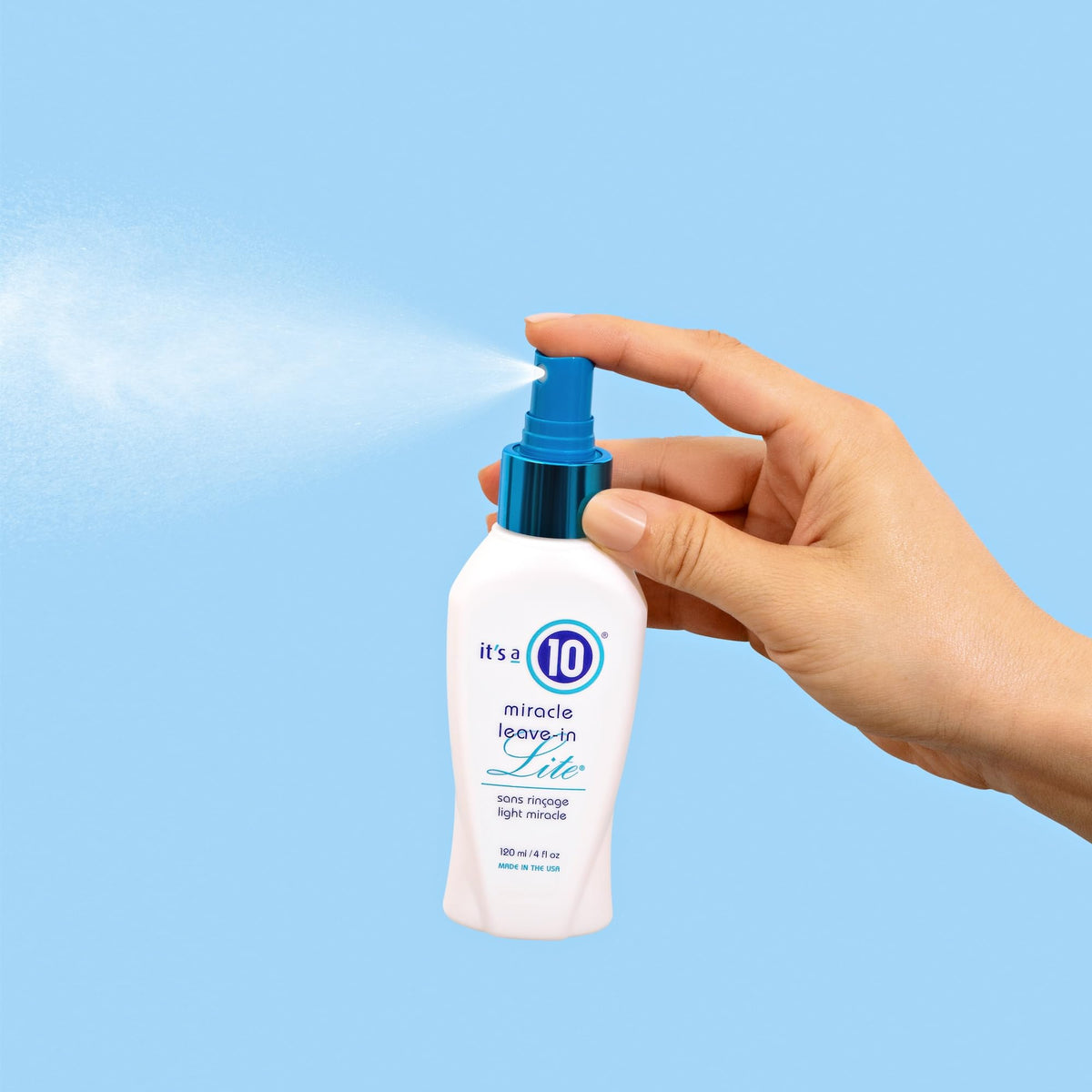 It's A 10 pump dispenser close-up highlighting label and travel size benefit