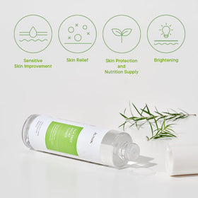 IUNIK bottle beside centella leaves showing botanical ingredients and soothing comfort